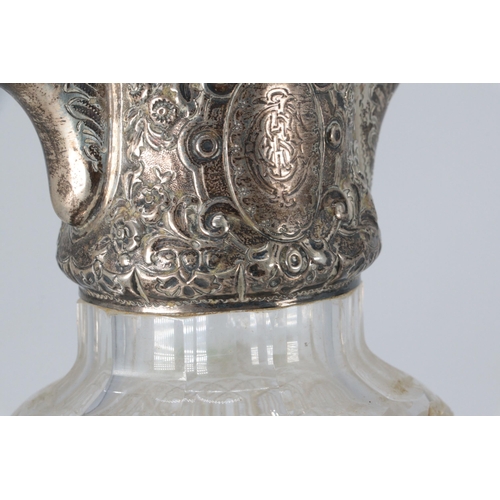 20 - A silver hallmarked claret jug with cut glass body approx. 15.5cm high