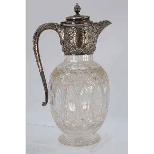 20 - A silver hallmarked claret jug with cut glass body approx. 15.5cm high