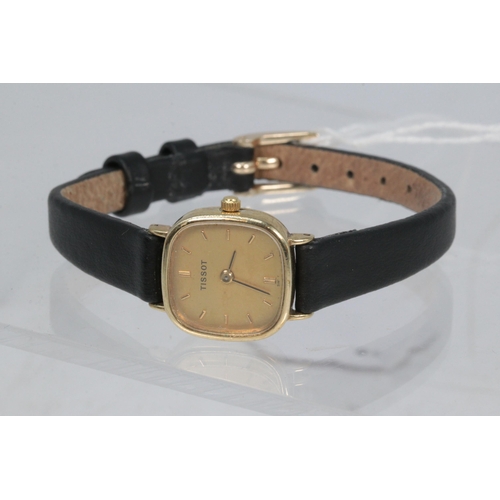 25 - Small Gold cased Tissot with leather strap.