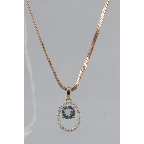 54 - A 9ct gold necklace together with a 9ct gold pendant set with diamonds and central blue stone (appro... 
