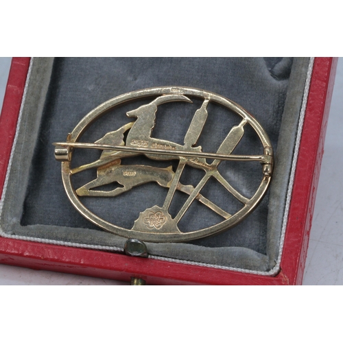 58 - 9ct Gold decorative brooch with leaping springboks (approx. weight 11.2g)