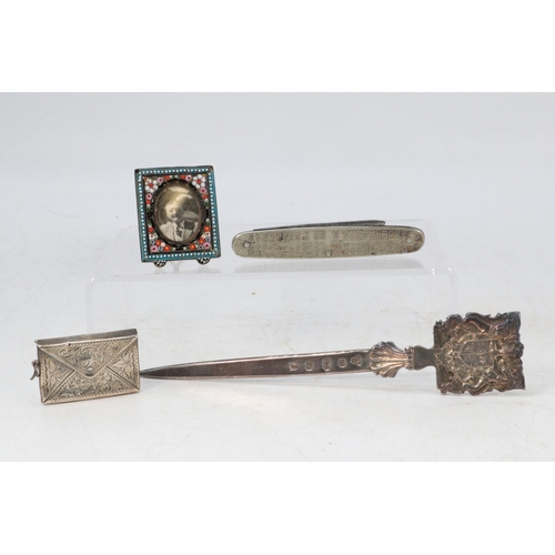 15 - A silver hallmarked paperknife, together with a sterling stamp case, micro mosaic frame and a Kings ... 