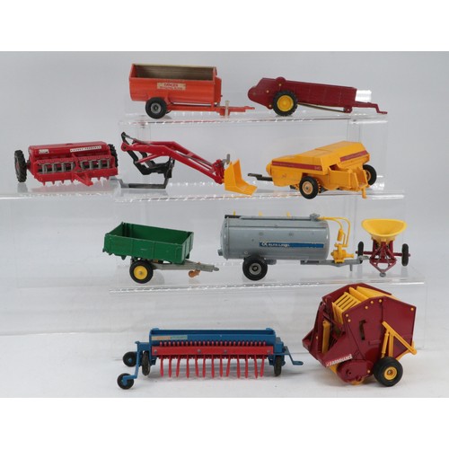 209 - Good selection of Britains farm implements and tractor accessories