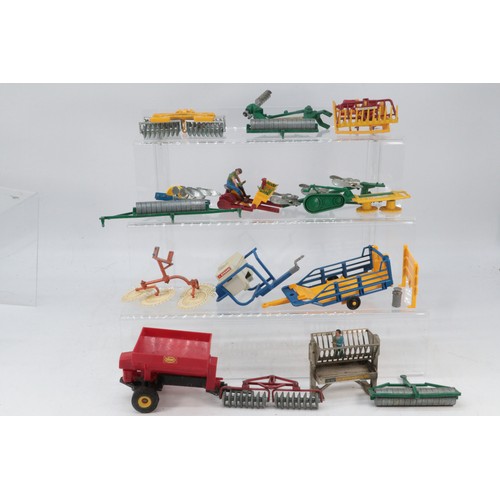 209 - Good selection of Britains farm implements and tractor accessories