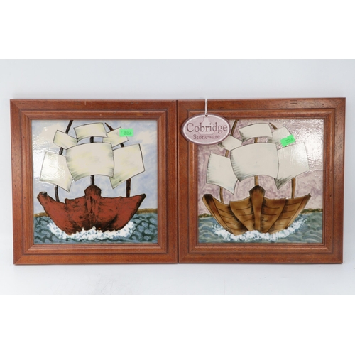 220 - Cobridge stoneware galleon plaques one on blue background the other pink