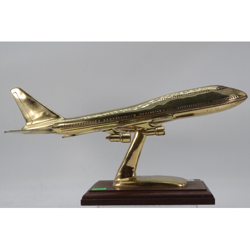 440 - Brass jumbo jet/airbus on wooden plinth