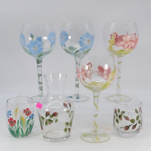 495 - A set of eight wine glasses decorated with Botanical Portmeirion style florals together with another... 