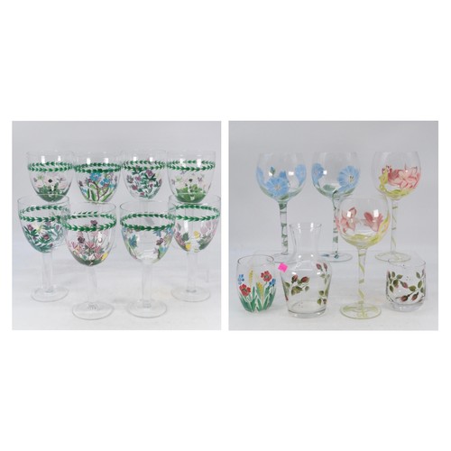 495 - A set of eight wine glasses decorated with Botanical Portmeirion style florals together with another... 