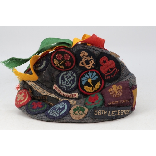 274E - A vintage girl guides and scouts woolly hat with assorted patches