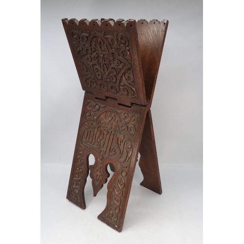 298 - An Eastern carved folding stand