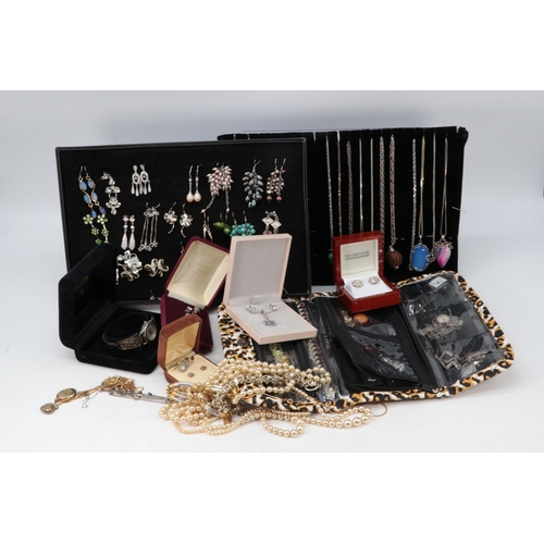 307A - A good quantity of assorted costume jewellery including silver chains and pendants, earrings, and a ... 