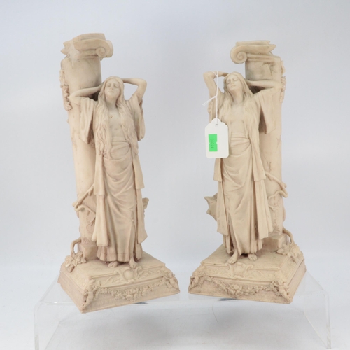 401 - Pair of Classical female figures resting against columns approx. 32 cm high