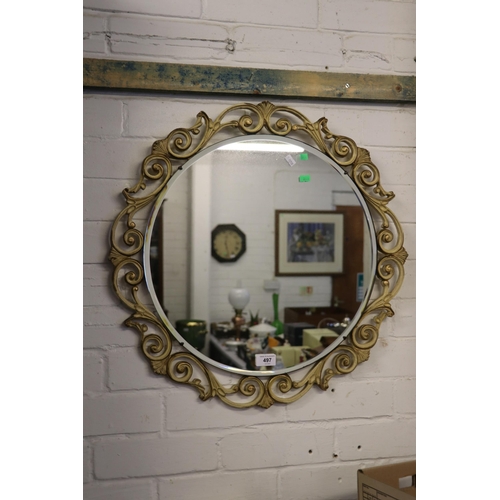 497 - Vintage circular wall mirror with bevelled edge in decorative gilt surround