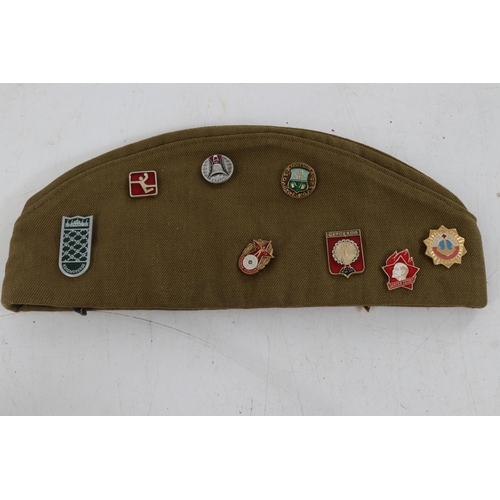 27 - A Russian military cap dated 1978 with Russian badges.