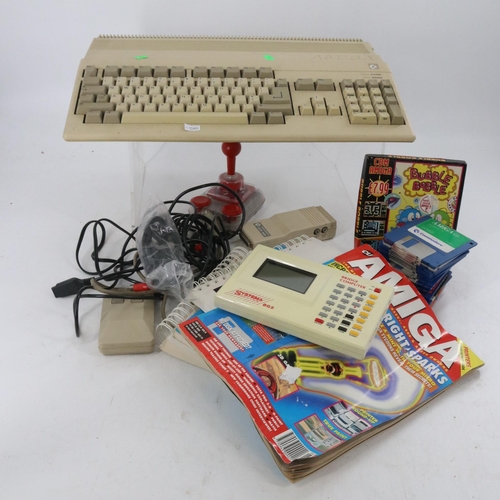 375B - Commodore Amiga together with disks manuals etc trade/spares/repairs