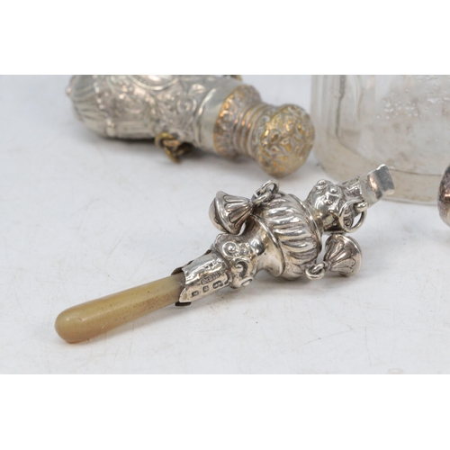 31 - Silver small babies rattle / whistle with mother of pearl handle together with a plated scent bottle... 