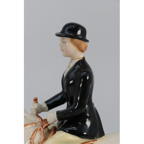 52 - Beswick Huntsman on brown horse, Huntswoman on grey dapple together with 5 hunting hounds