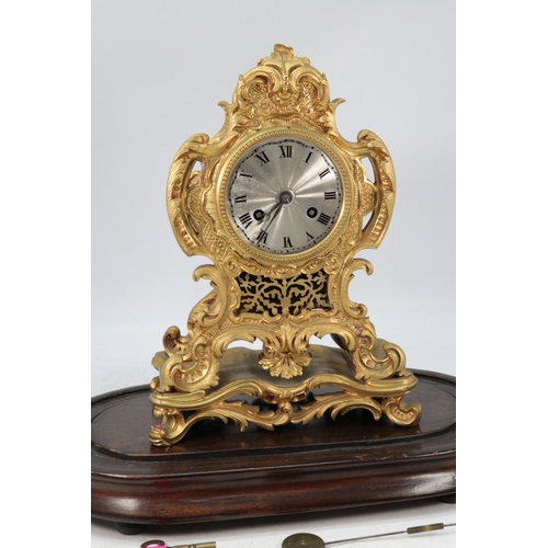 118 - French mantle clock under glass dome on plinth. Key and pendulum.