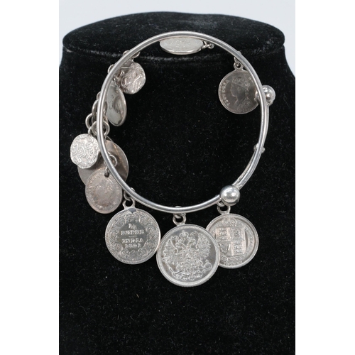 180 - White metal bracelet with attached selection of Antique silver coins