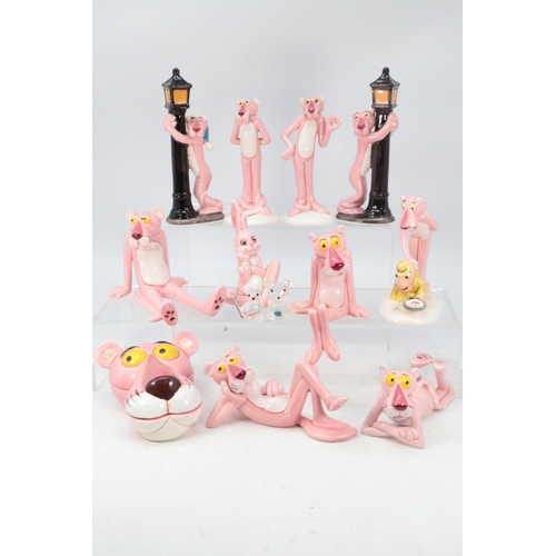 215 - A selection of Pink Panther collectables together with two small glass figures