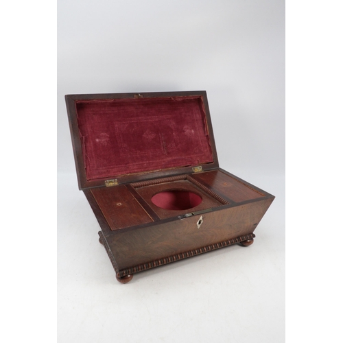 257 - Antique mahogany tea caddy on bun feet.