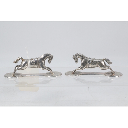 19 - Pair of vintage Silver plated knife rests in the form of race horses.