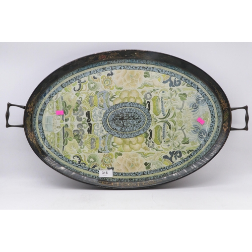 316 - A vintage oriental lacquered two handled tray with inset glass and faded embroided panel under