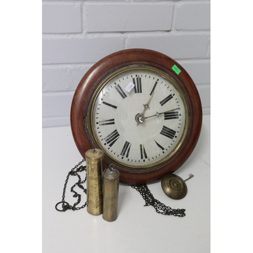 435 - A wall hanging clock with pendulum and weights