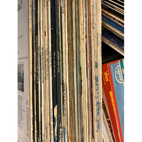 394 - A large quantity of assorted records to include The Magic Roundabout, Phil Collins, Perry Como, etc