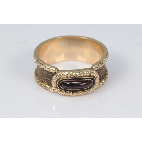 177 - Antique mourning ring with centre stone garnet? no engravings, braded with hair round the edges