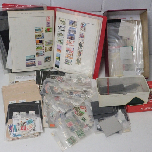 482 - A carton of assorted loose and stock stamps with Philatic stamp holders etc