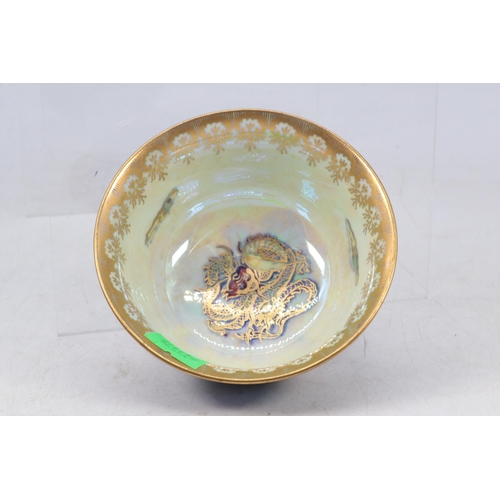 38 - Wedgwood Dragon and Tiger decorated lustre bowl. approx 10cms diameter by 5cms tall