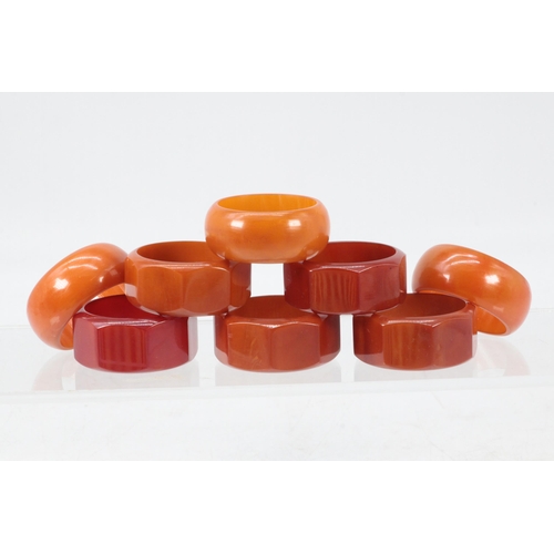 68 - Selection of Art deco amber coloured plastic napkin rings