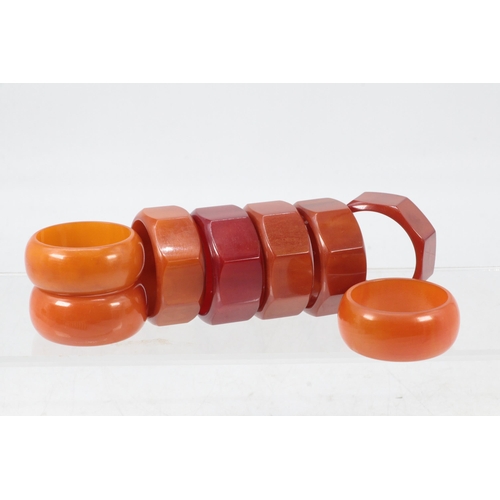 68 - Selection of Art deco amber coloured plastic napkin rings