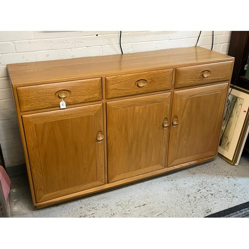 501 - An contemporary Ercol sideboard three drawers over three door cupboard base on plinth approx. approx... 