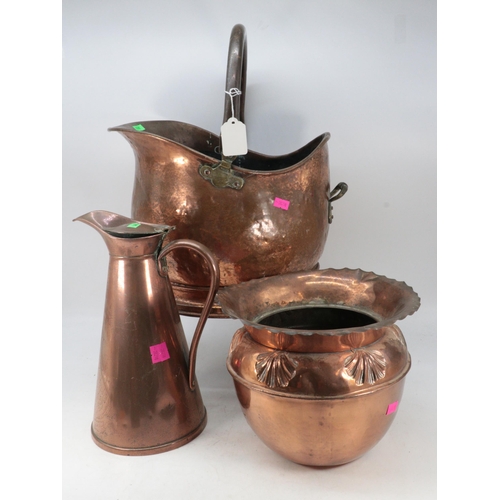 477 - A copper coal scuttle together with a JS and S copper lidded water jug and an Art Nouveau style jard... 