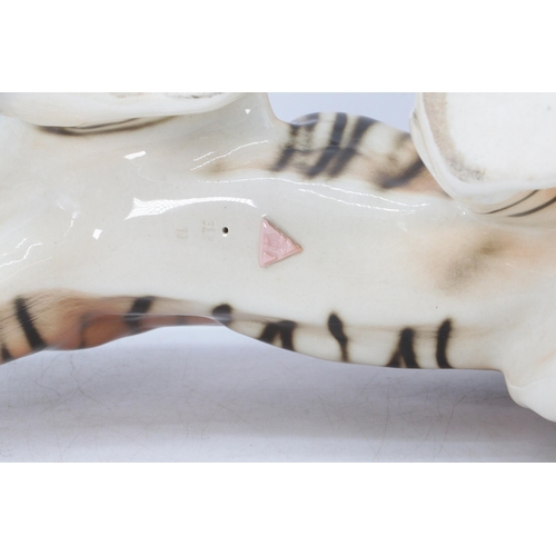 494 - A porcelain Dux ceramic tiger (approx. 55cm overall length)