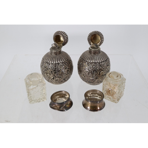 4 - Two silver scent bottles together with two silver topped scent bottles (note damage to one) examine