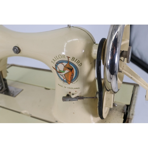 70 - A Taylor-Bird hand sewing machine in case that expands into sewing table.