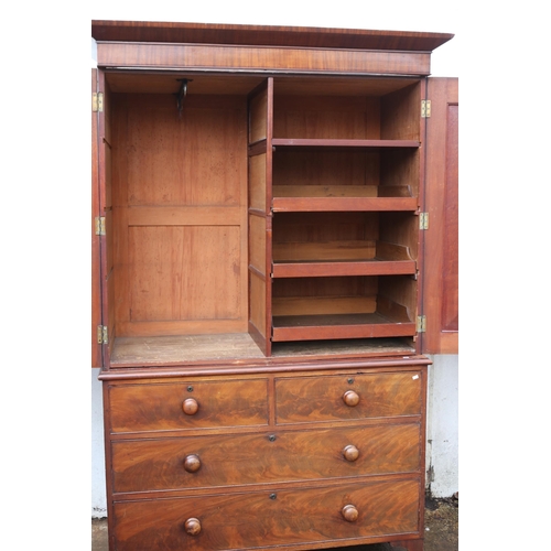 72 - 19th century mahogany linen press enclosed by two panelled doors over two over two drawers on bracke... 