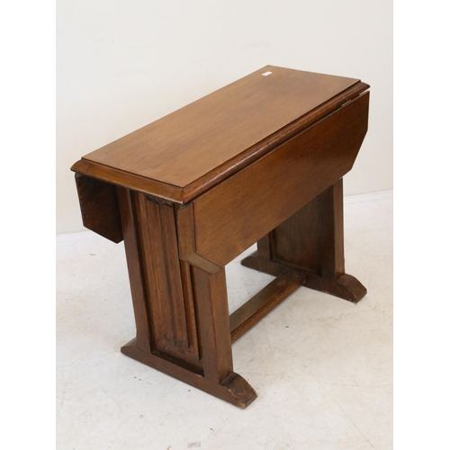 121 - Utility Era drop leaf side table with linen fold design to ends measures approx. 59cm w x 56cm d x 4... 