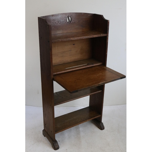 256 - Arts and craft oak bureau bookcase measures approx. 60cm w x 28cm d x 123cm h