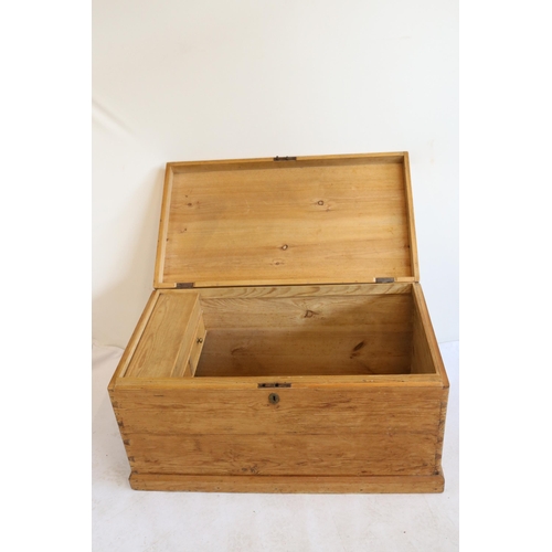 337 - A pine storage trunk with two drawers and storage compartment inside. It measures approx. 96W x 53D ... 