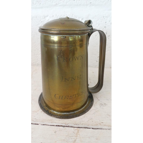 379 - A selection of metalwares, copper, brass and pewter, notable is a brass tankard with Arts & Crafts s... 