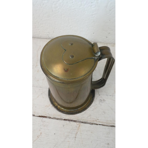 379 - A selection of metalwares, copper, brass and pewter, notable is a brass tankard with Arts & Crafts s... 