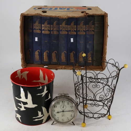 511 - Nine volumes of Punch circa 1890, vintage waste paper baskets and a Goliath alarm clock and a waterl... 