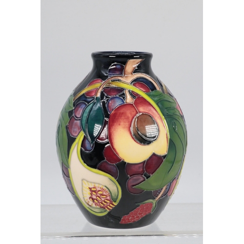 40 - Moorcroft vase in the Queens Choice pattern, approx. 12cm tall, fully marked to base