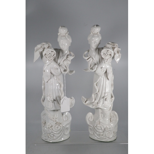 143 - Two Blanc de Chine figures, measure approx. 36cm high