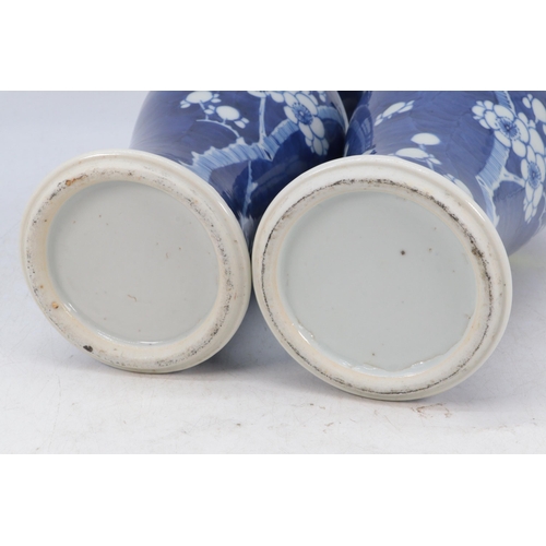 144 - A pair of Chinese ceramic prunus decorated vases with stands (approx. 30cm tall not including stand)