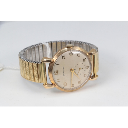 148 - A 9ct gold cased Garrard gents wristwatch (appears working at time of cataloguing, but not tested ov... 